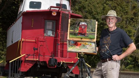 Pittsburgh artist Ron Donoughe finishes a painting of the caboose at the California Public Library, California, Pa. The painting will be featured in the exhibition “Brownsville to Braddock: Paintings of the Monongahela Valley” in the Manderino Library, Cal U, from Nov. 8 thru Dec. 3, 2021 