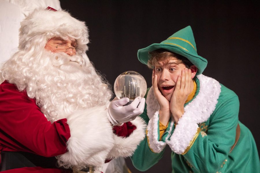 Santa+Claus%2C+played+by+Toby+Maykuth+of+Masontown%2C+describes+New+York+City+to+Buddy+the+Elf%2C+played+by+senior+theater+major+Dan+Nuttall+of+Brownsville.