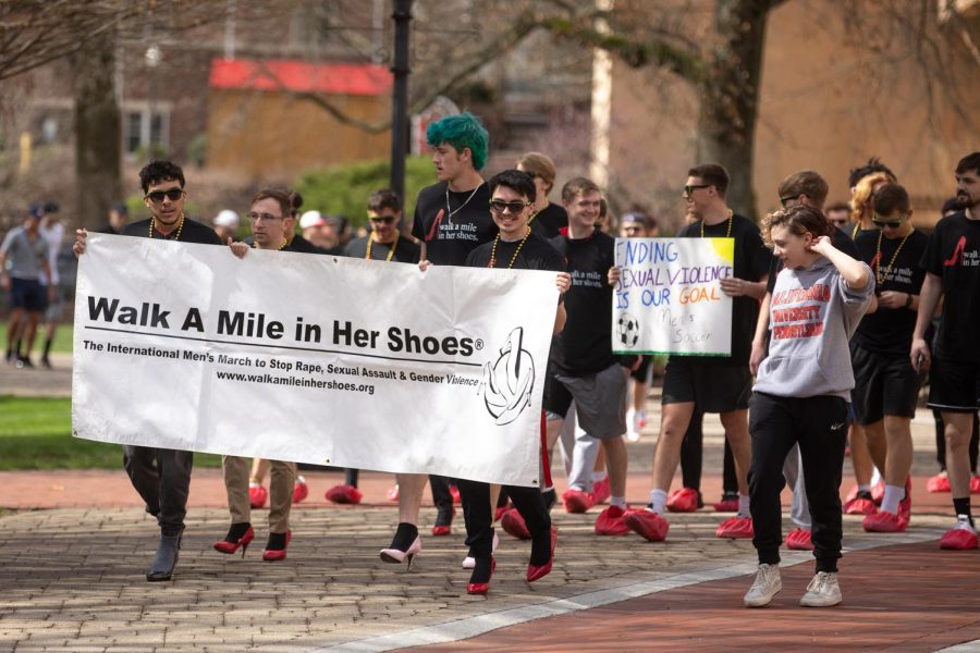 Men march on Cal Us campus to raise awareness around domestic violence and sexual assault on April 12, 2022. 