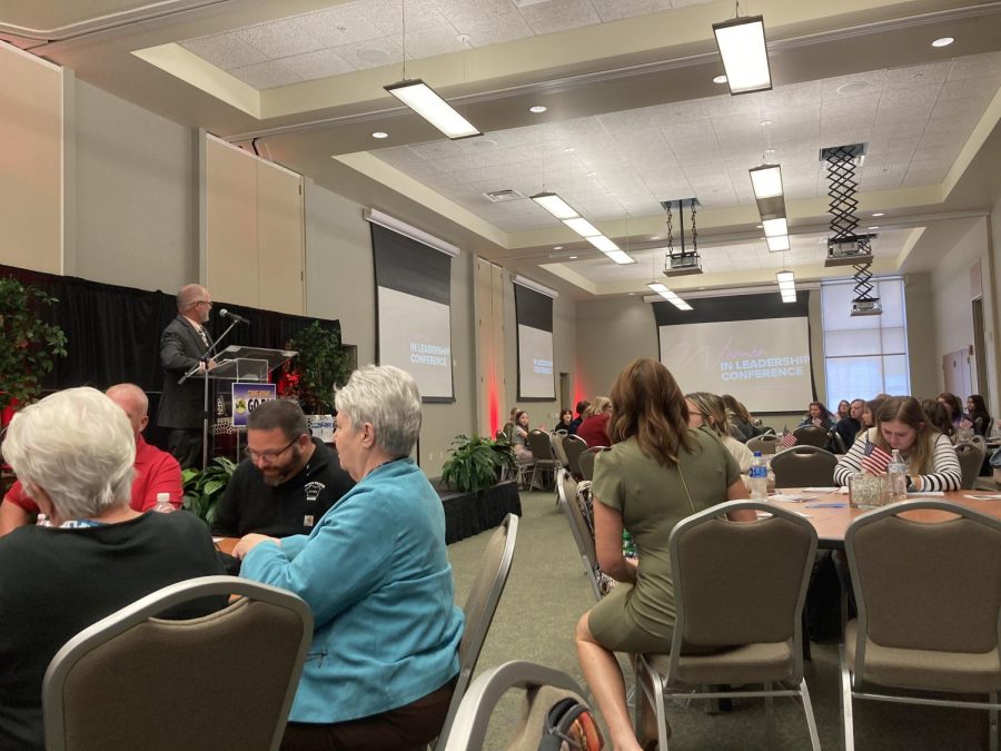 Bud Cook introducing the Keynote Speaker at the Women in Leadership Conference