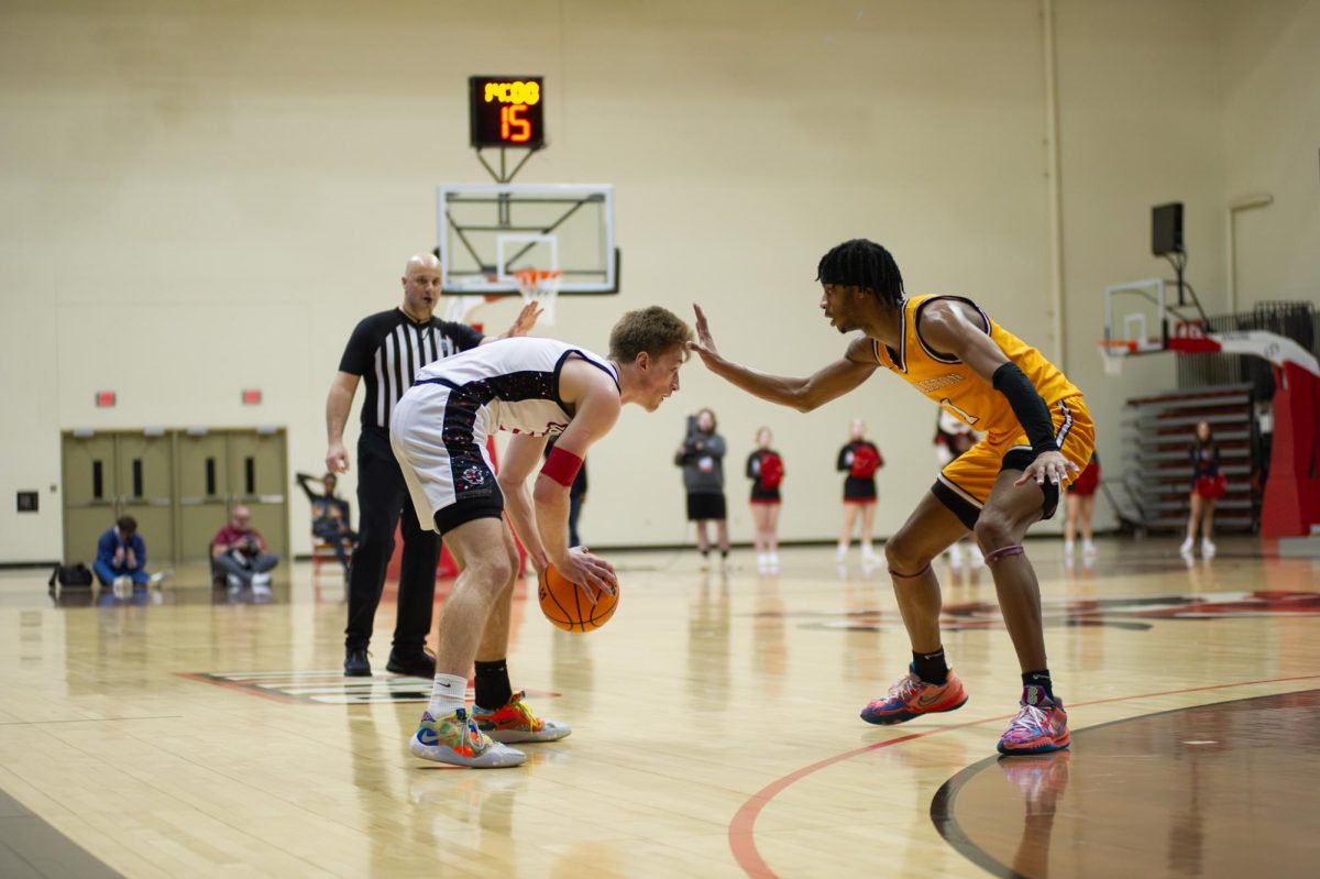 KJ McClurg being covered by a Charleston player