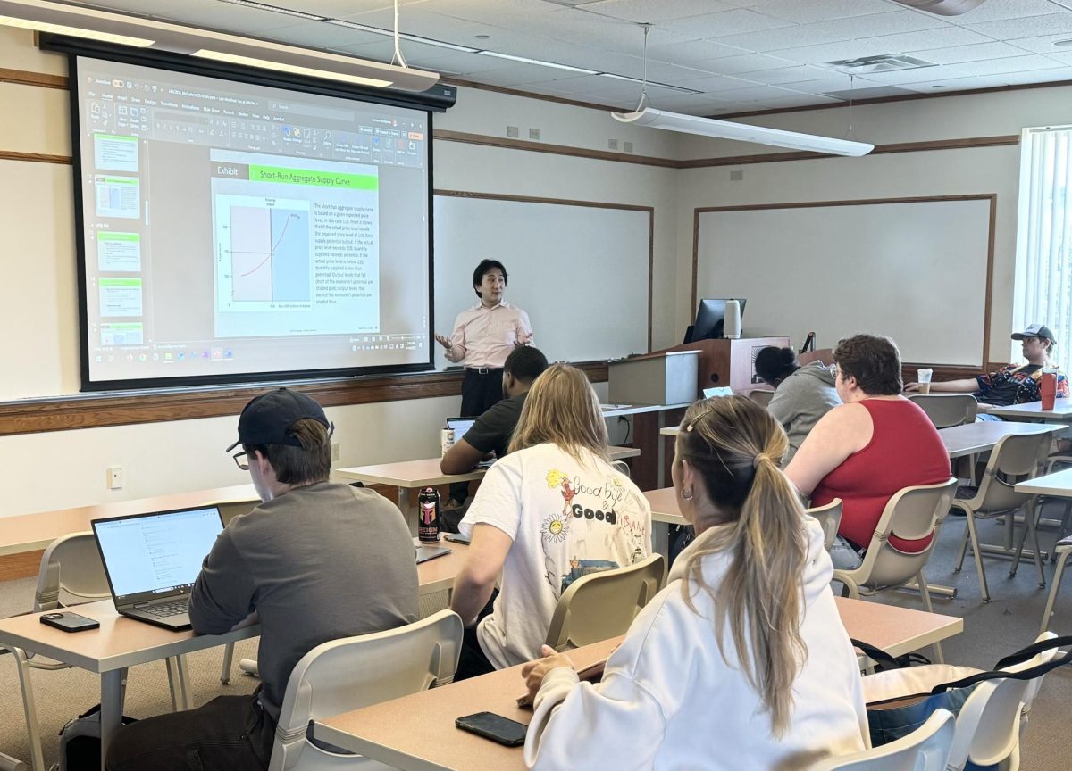 Dr.  Murayama teaching his Economics class