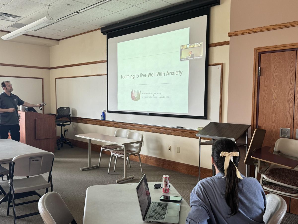 Professor John Paul Staszel and PennWest Cal students view anxiety webinar from Duda Hall.