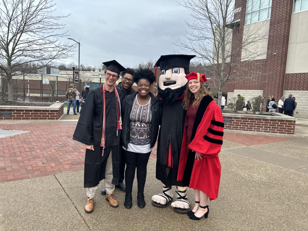 PennWest California Students during the December 2023 Commencement Ceremony from left: Owen Leason, Braxton Turner, Noah Turner, Vulcans Mascot Blaze, and Sarah Seader