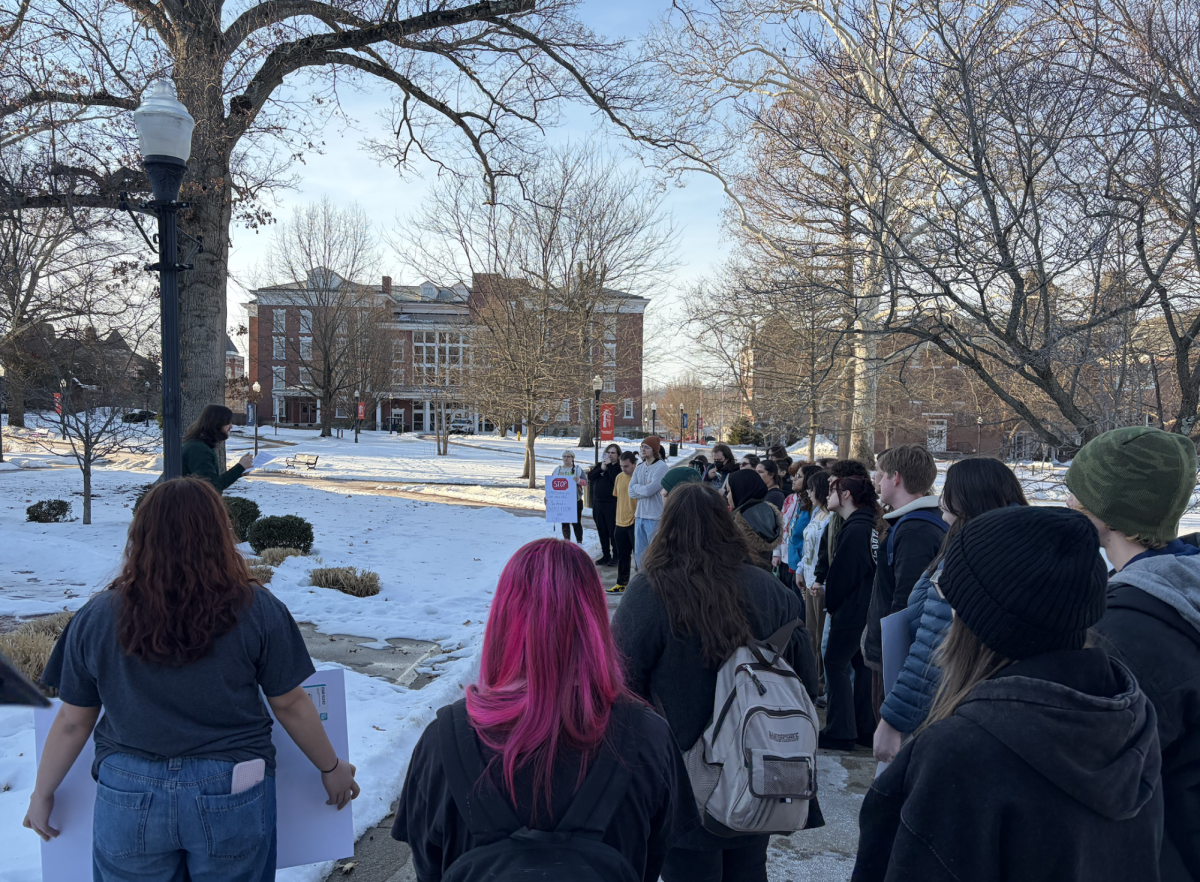 PennWest Cal students gather around Blaze the Vulcan statue for speeches. 