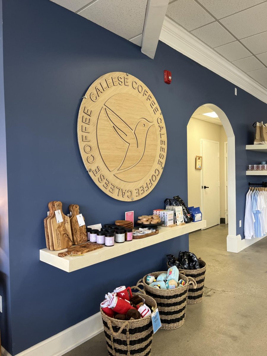 Wall decor of Caleese Coffee's logo inside their coffee shop