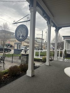 Hanging sign for White Tree Cafe & Coffeehouse