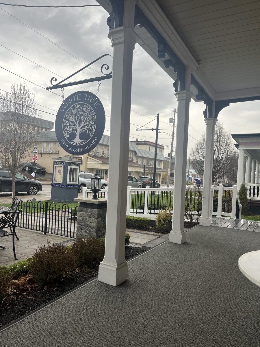 Hanging sign for White Tree Cafe & Coffeehouse