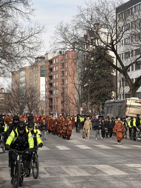 Police officers on bicycles as the monks continued their walk, guarding them from potential disruptions or attacks.