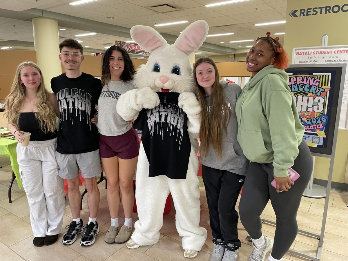Students pose for a group photo with the Easter Bunny (center) holding a "Vulcan Nation" t-shirt