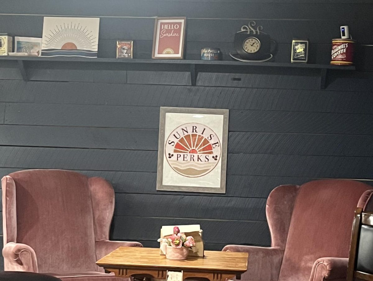 An indoor sign for Sunrise Perks coffee shop.