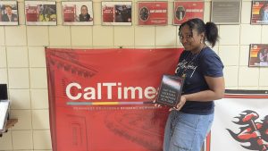 Me posing with my final awards plaque before graduation.